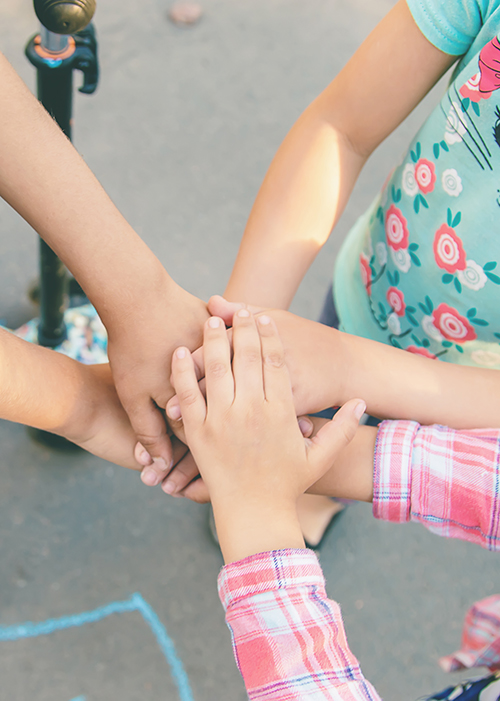 hands of children, many friends, games. Selective focus